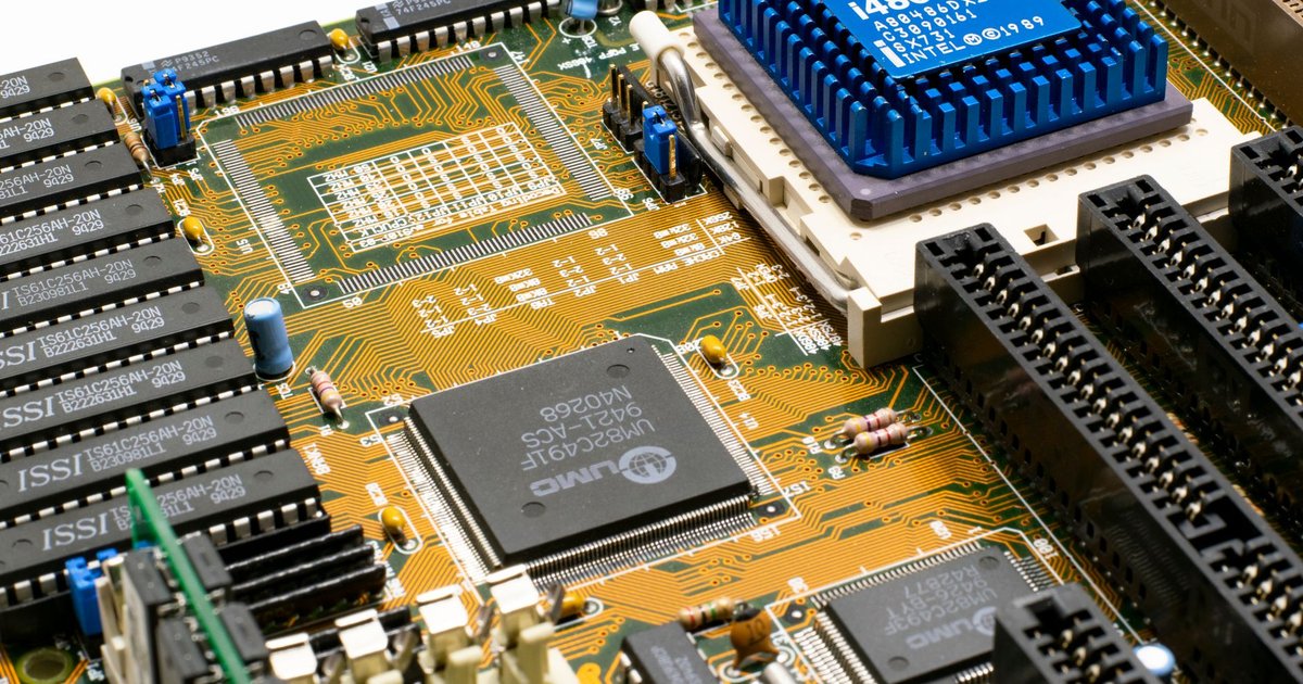 Detailed view of an Intel i486 DX2 CPU installed on a vintage motherboard with chips and circuits.